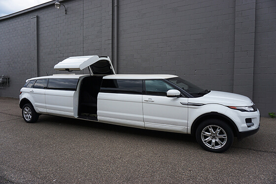 White stretch limo with jet doors
