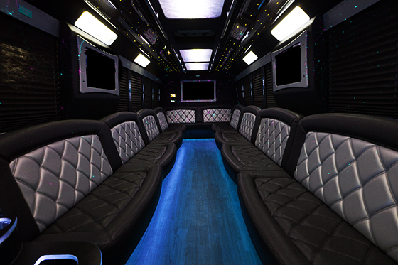Limo-style seating on Waldorf party bus